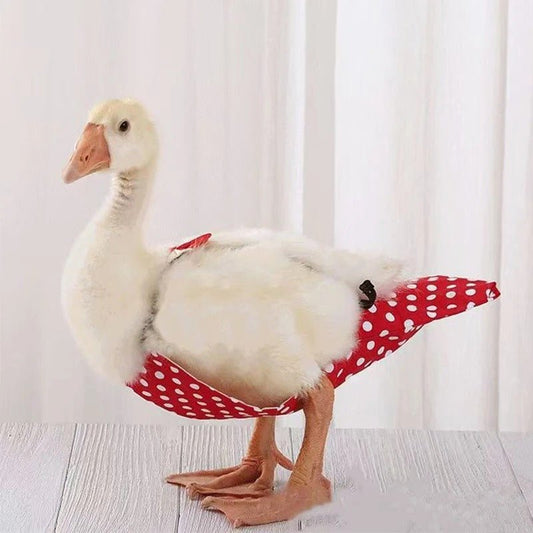 Banana Ducks/Goose wearing a red polka dot garment diaper on a light background