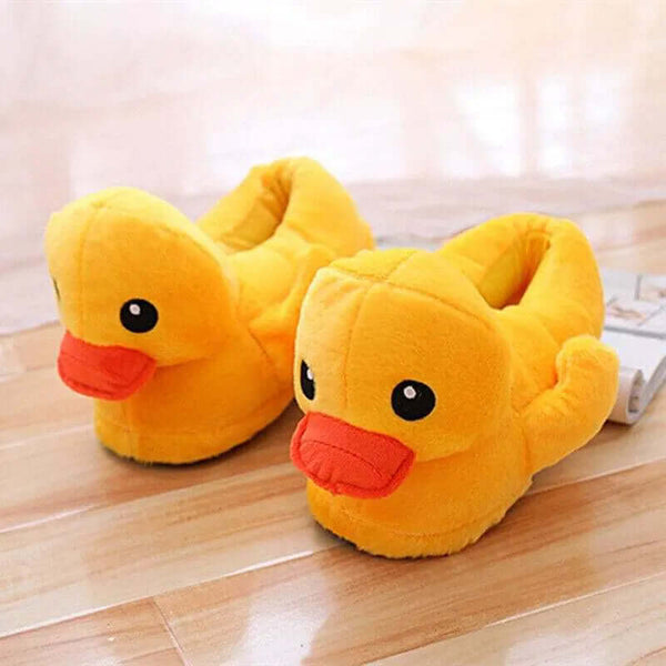 Yellow Banana Duck plush slippers shown together from the front